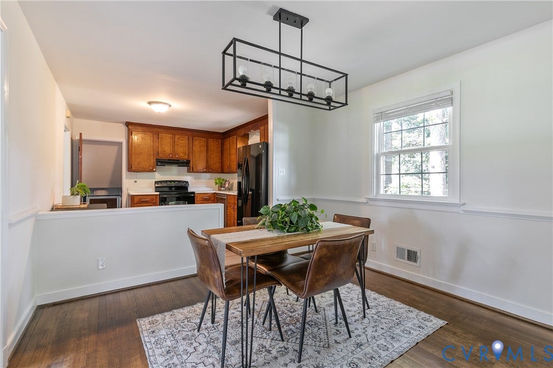 200 Stanmore Road, North Chesterfield, VA 23236 Dining area featuring wood-finish flooring, a contemporary linear chandelier, and a window with natural light