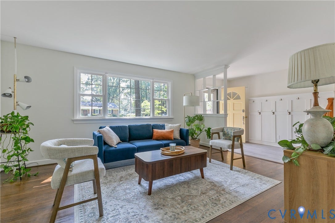 200 Stanmore Road, North Chesterfield, VA 23236 Spacious living area featuring large windows, wood-finish flooring, and built-in storage