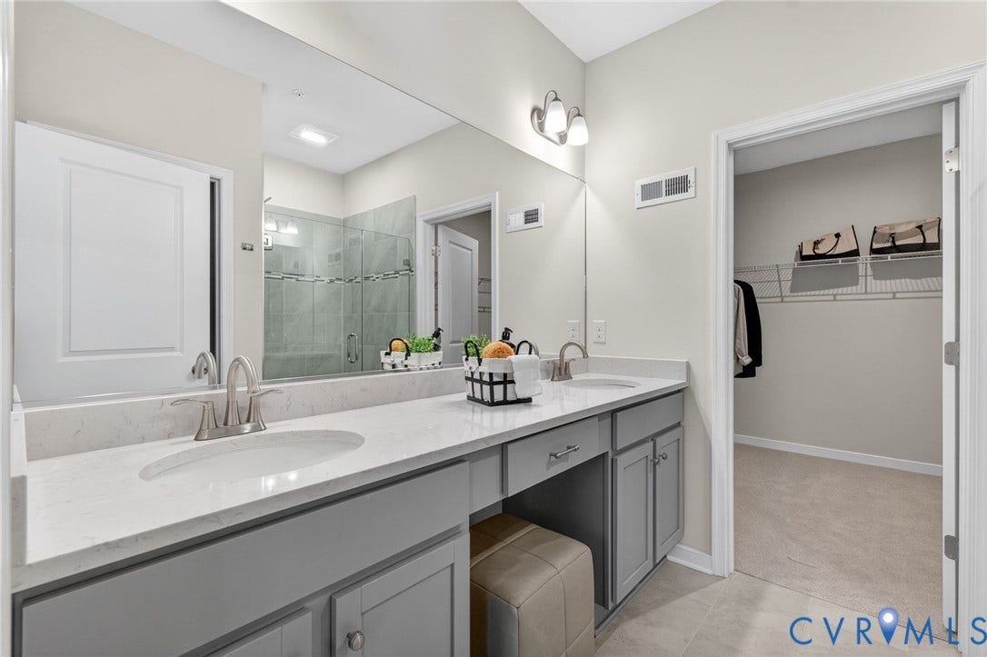 2439 Ownby Lane, #B 13, Richmond, VA 23220 Dual vanity with stone-finish countertops, undermount sinks, and brushed nickel fixtures