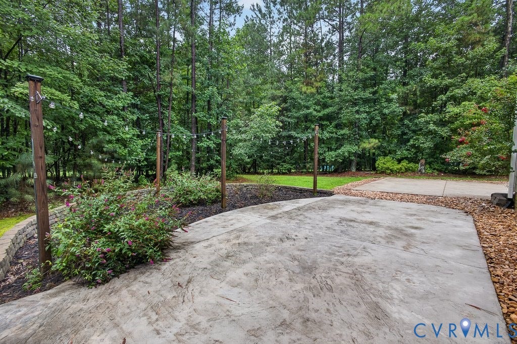 8825 First Branch Lane, Chesterfield, VA 23838 Expansive concrete patio with integrated string lighting