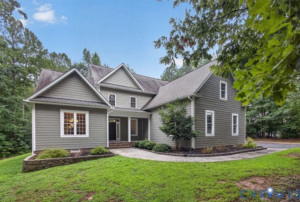 8825 First Branch Lane, Chesterfield, VA 23838 Multi-gabled exterior with siding, white trim windows, and a covered entry