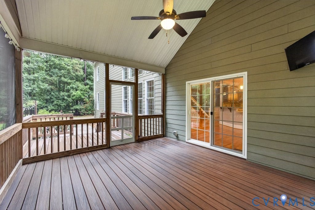 8825 First Branch Lane, Chesterfield, VA 23838 Screened porch featuring a vaulted ceiling, ceiling fan, and composite decking