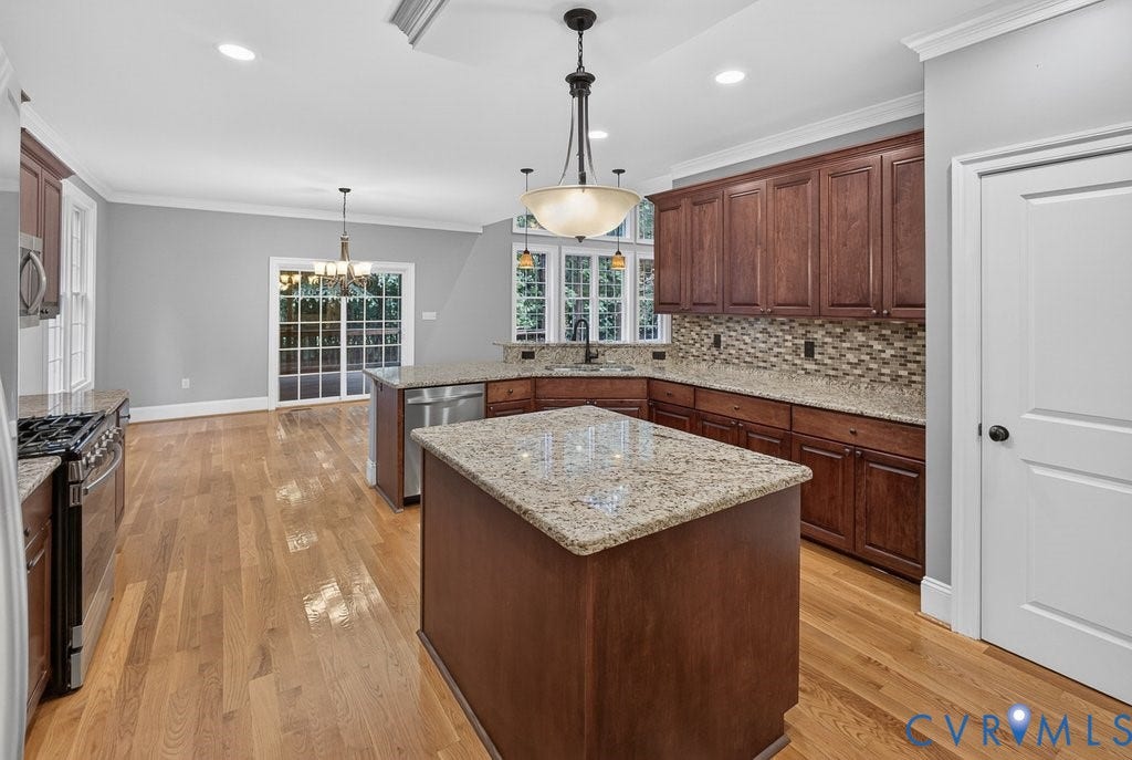 8825 First Branch Lane, Chesterfield, VA 23838 Hardwood flooring, two-tier kitchen island, stainless steel appliances, granite countertops, and mosaic tile backsplash