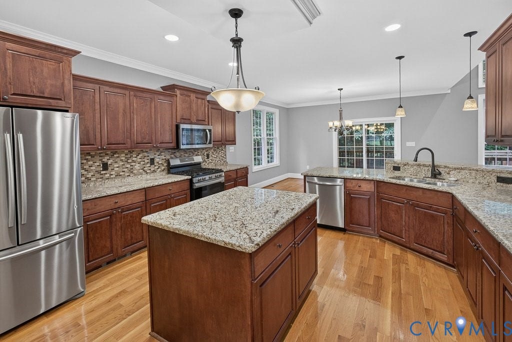 8825 First Branch Lane, Chesterfield, VA 23838 Kitchen with wood-finish flooring, central island, stainless steel appliances, granite countertops, and wood cabinetry