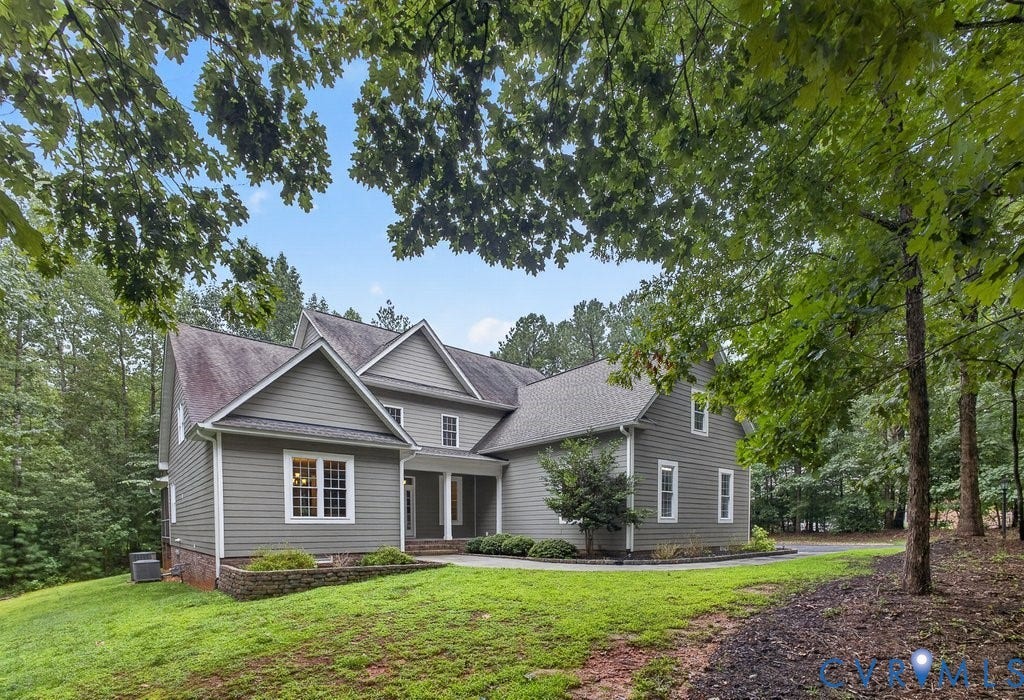 8825 First Branch Lane, Chesterfield, VA 23838 Two-story residential structure with multiple gables, siding exterior, and white-framed windows