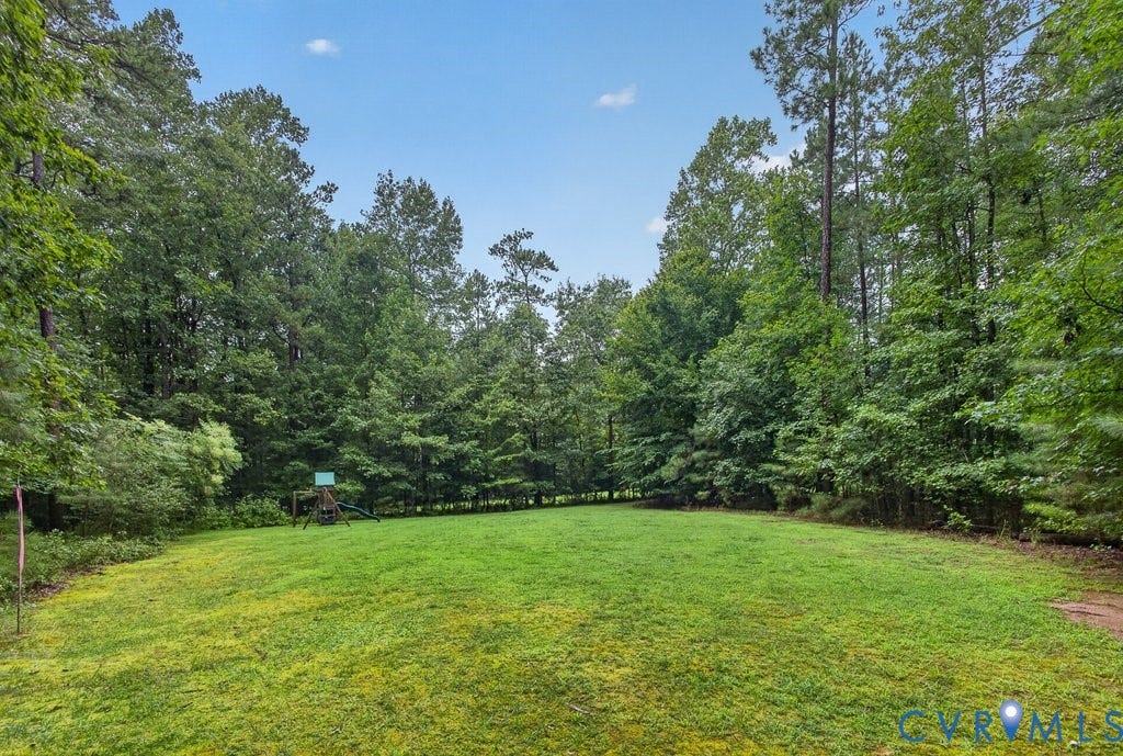 8825 First Branch Lane, Chesterfield, VA 23838 Expansive green lawn surrounded by mature trees