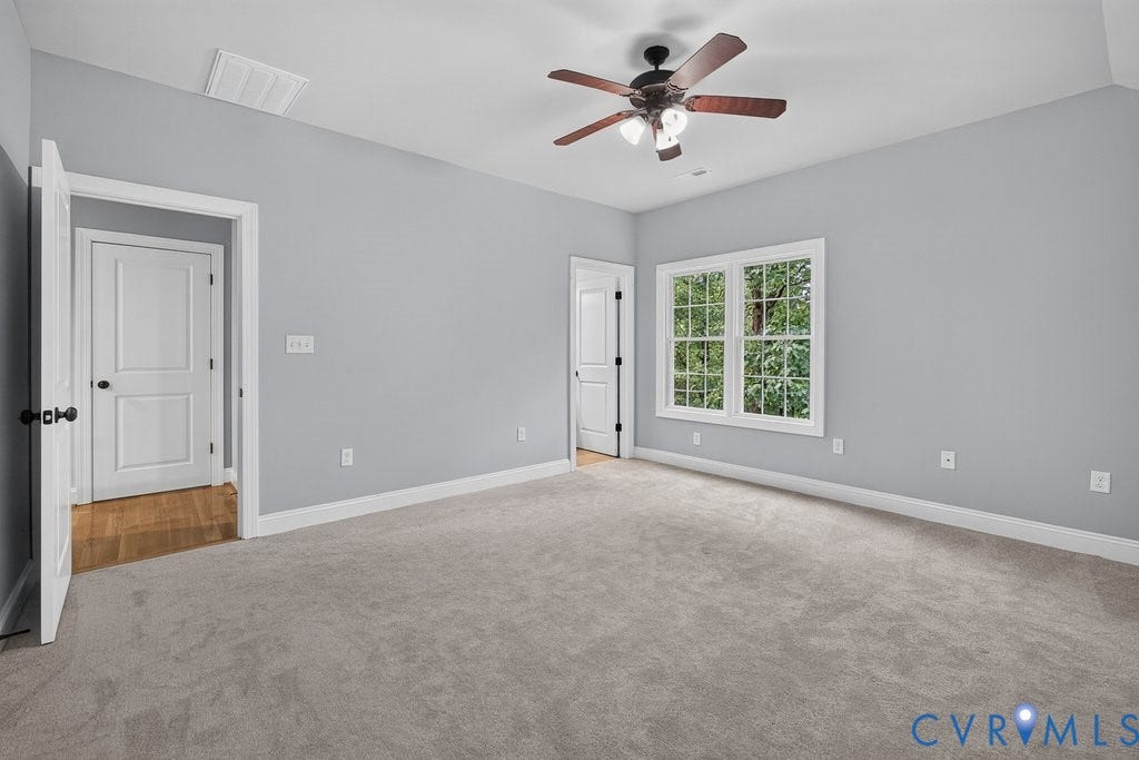 8825 First Branch Lane, Chesterfield, VA 23838 Carpeted room featuring a ceiling fan with integrated lighting, a double casement window, and painted walls