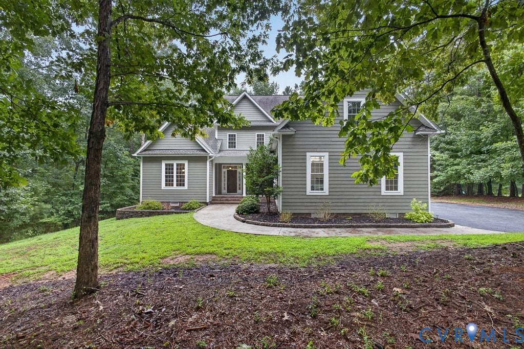8825 First Branch Lane, Chesterfield, VA 23838 Two-story home with a gabled roofline, siding exterior, and multiple white-framed windows