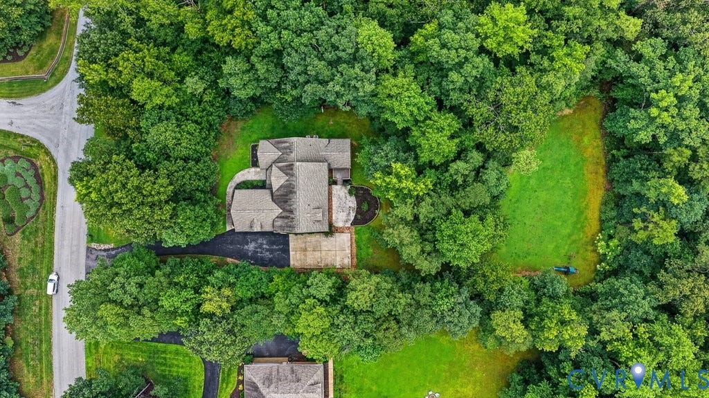 8825 First Branch Lane, Chesterfield, VA 23838 Aerial view showcasing a substantial stone residence nestled within mature landscaping and lush grounds