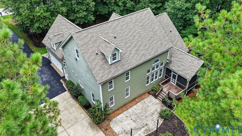 8825 First Branch Lane, Chesterfield, VA 23838 Green siding exterior with a multi-gabled roof and dormer windows