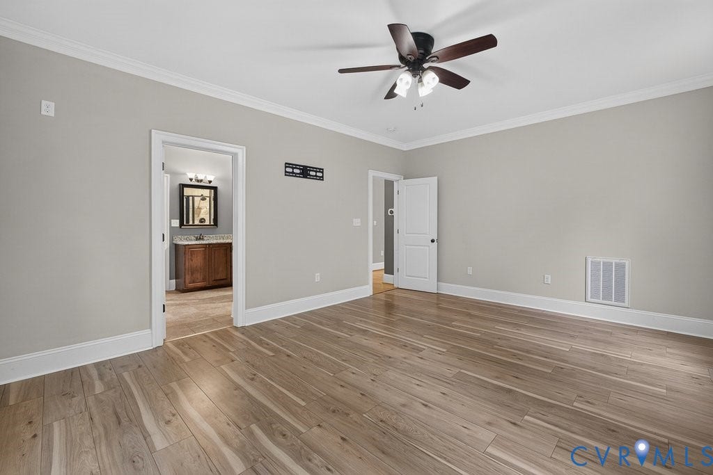 8825 First Branch Lane, Chesterfield, VA 23838 Wood-finish flooring, crown molding, and a ceiling fan with integrated lighting