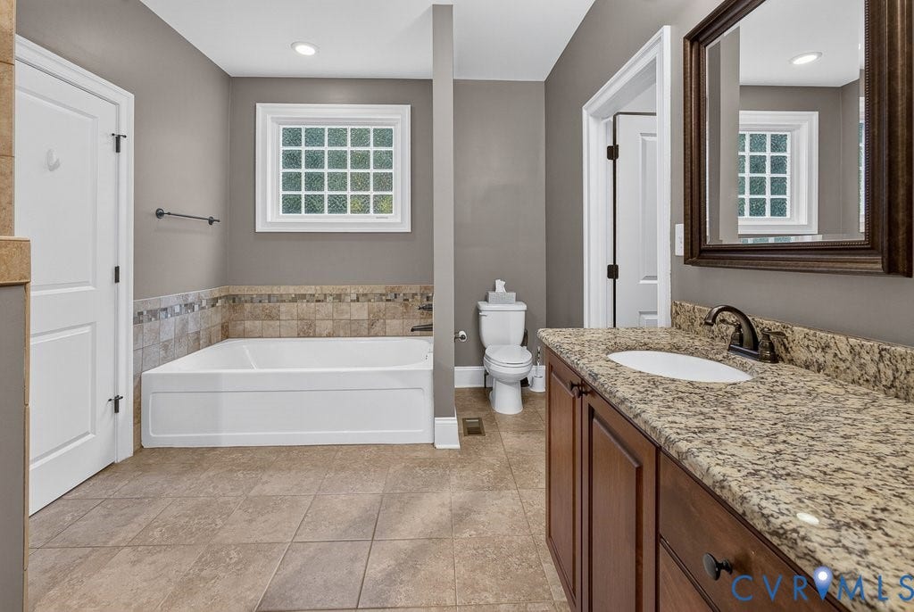 8825 First Branch Lane, Chesterfield, VA 23838 Built-in soaking tub with decorative tile surround