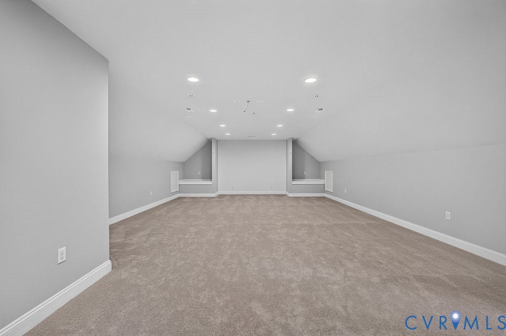 8825 First Branch Lane, Chesterfield, VA 23838 Spacious room featuring carpeting, recessed lighting, and sloped ceilings