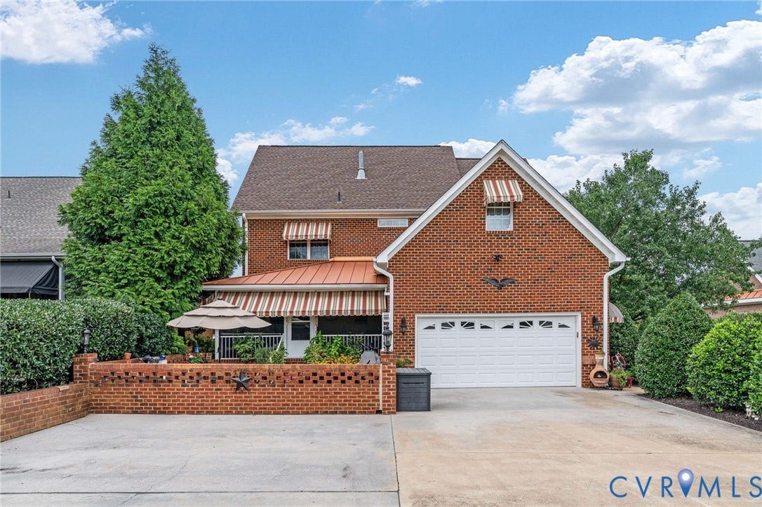 Brick facade with a white garage door