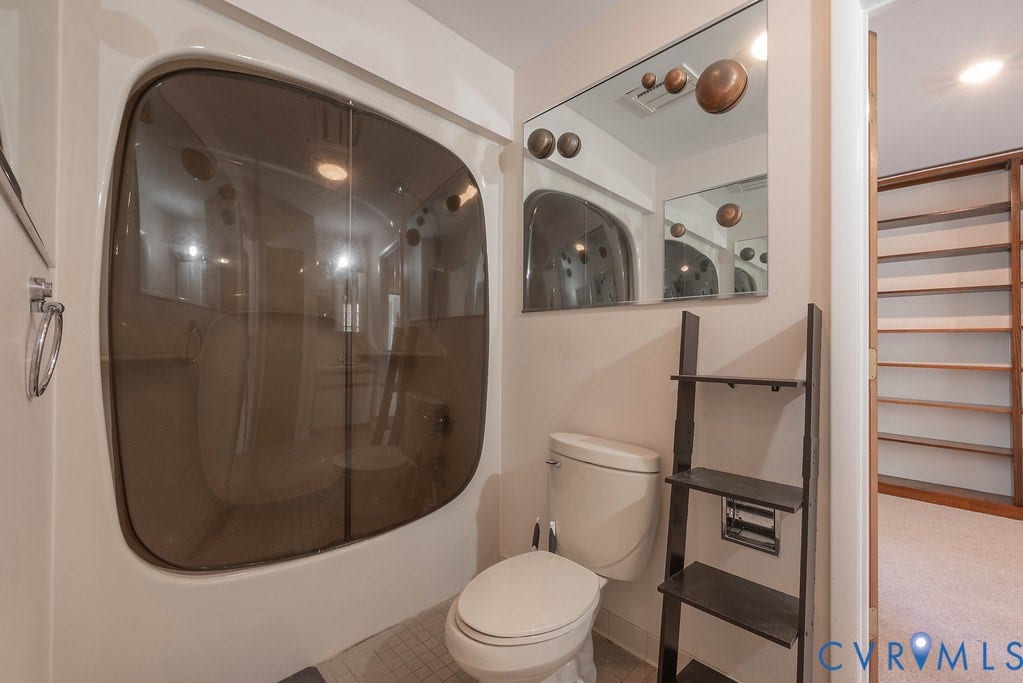 Enclosed shower unit with tinted glass paneling