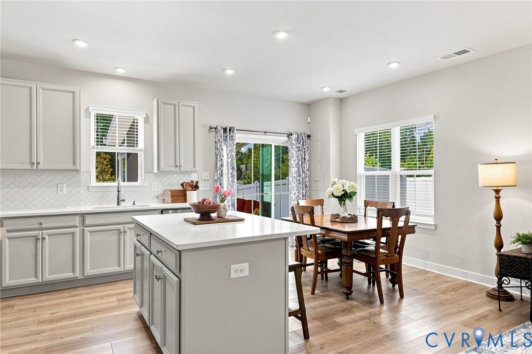 10877 Genito Square Drive, Midlothian, VA 23112 Dining area with screened porch beyond