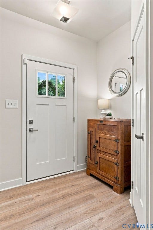 10877 Genito Square Drive, Midlothian, VA 23112 Coat closet, entry way, woodgrain LVP throughout first floor.