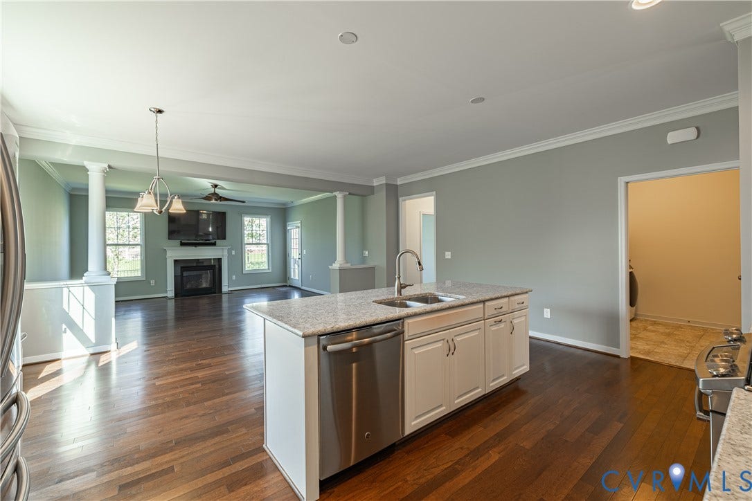 Kitchen island with granite countertops and stainless steel sink