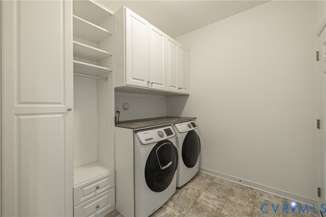 Custom cabinetry, a built-in hanging rod, two drawers, and open shelving