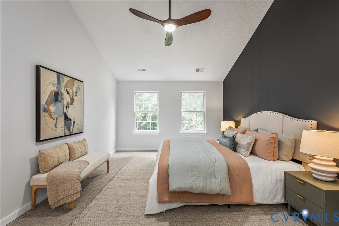 3929 Meadowview Lane, Richmond, VA 23223 Vaulted ceiling featuring a ceiling fan, dual windows, and an accent wall