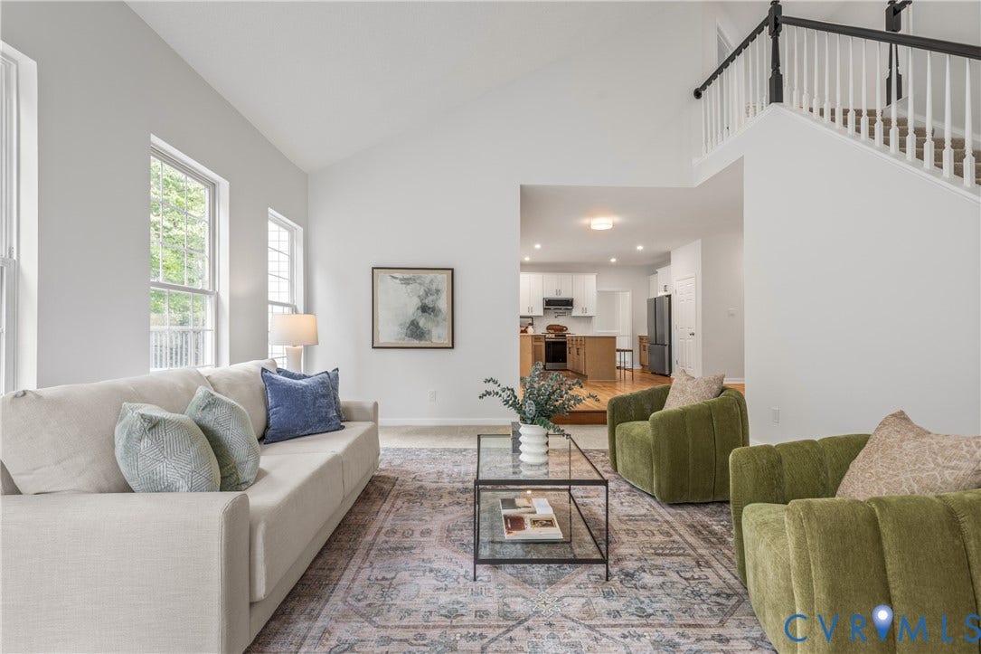 3929 Meadowview Lane, Richmond, VA 23223 Vaulted ceiling, multiple windows, staircase with white spindles, recessed lighting, wood-finish flooring
