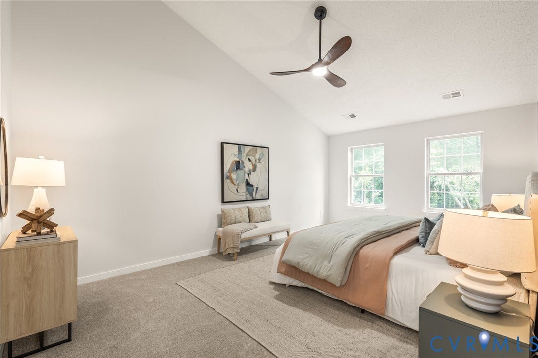 3929 Meadowview Lane, Richmond, VA 23223 Vaulted ceiling with a ceiling fan, dual windows, and wall-to-wall carpeting