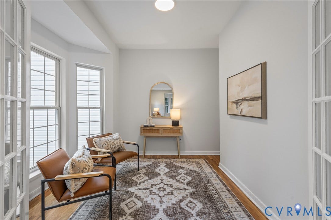 3929 Meadowview Lane, Richmond, VA 23223 Bay window with multiple double-hung windows, wood-finish flooring, and white French doors
