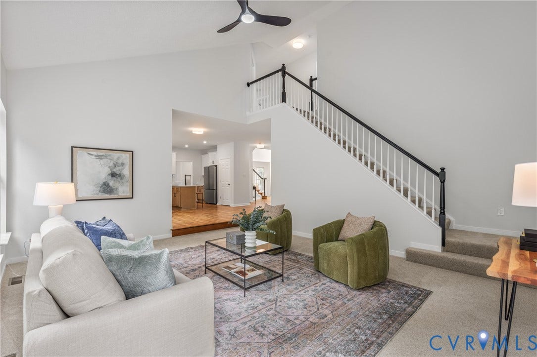 3929 Meadowview Lane, Richmond, VA 23223 Open-concept living area with soaring ceilings, ceiling fan, and abundant natural light