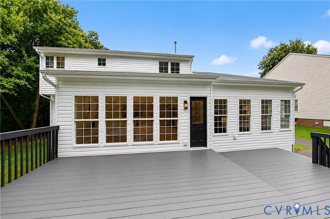 3929 Meadowview Lane, Richmond, VA 23223 Expansive exterior deck with dark gray surface and black railings
