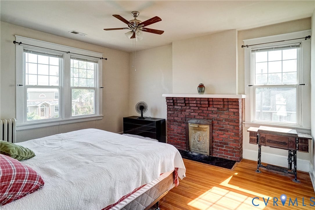 801 Edge Hill Road, Battery Court, Richmond, VA 23222 Hardwood flooring, brick fireplace with mantel, ceiling fan, and multiple windows