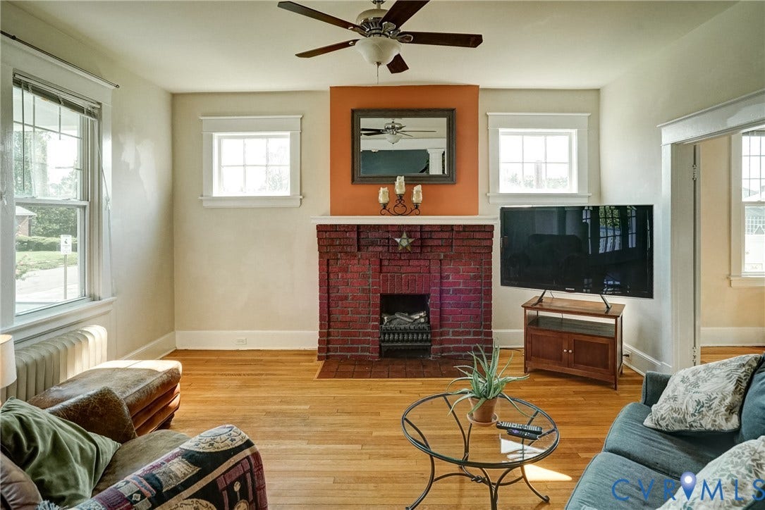 801 Edge Hill Road, Battery Court, Richmond, VA 23222 Hardwood flooring, brick fireplace, ceiling fan, and multiple windows