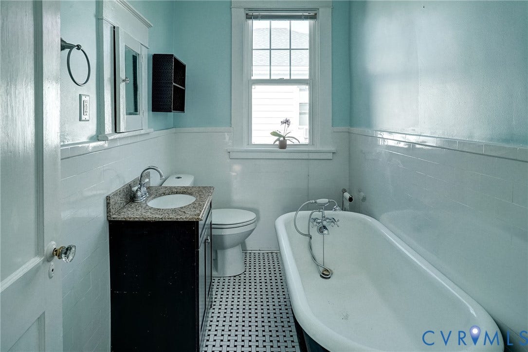 801 Edge Hill Road, Battery Court, Richmond, VA 23222 2nd floor hall bath with Clawfoot tub, vanity with stone countertop, built-in medicine cabinet, tiled wainscoting, and mosaic tile flooring