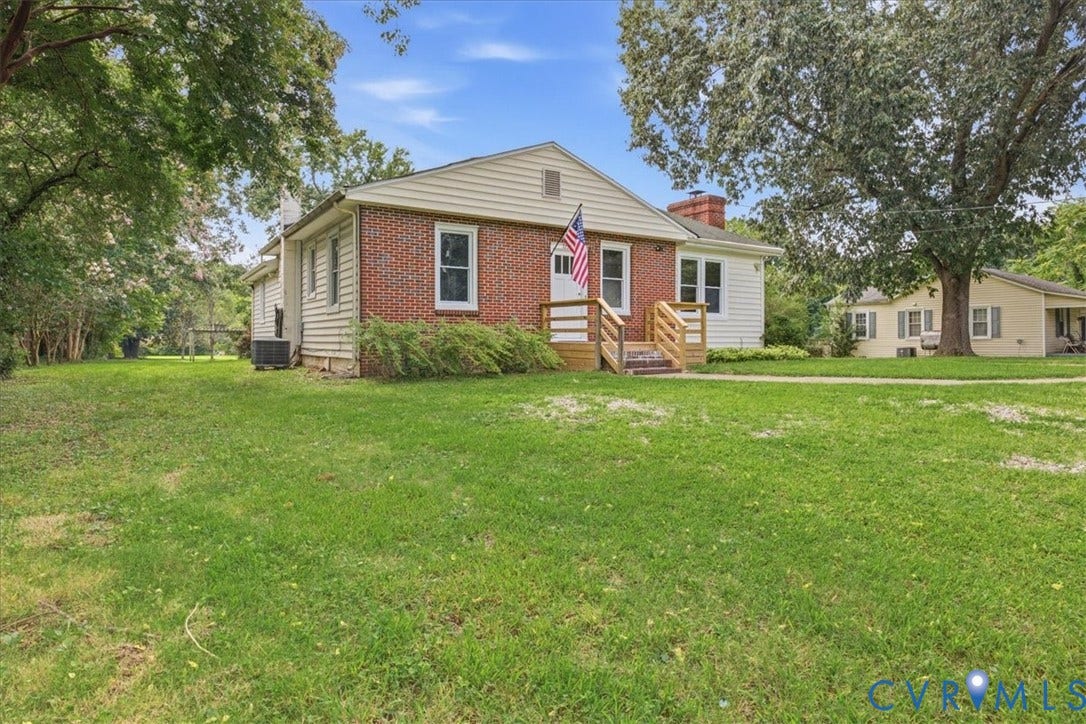 7232 Hopkins Road, North Chesterfield, VA 23237 Brick and siding exterior with a wood-framed porch and steps