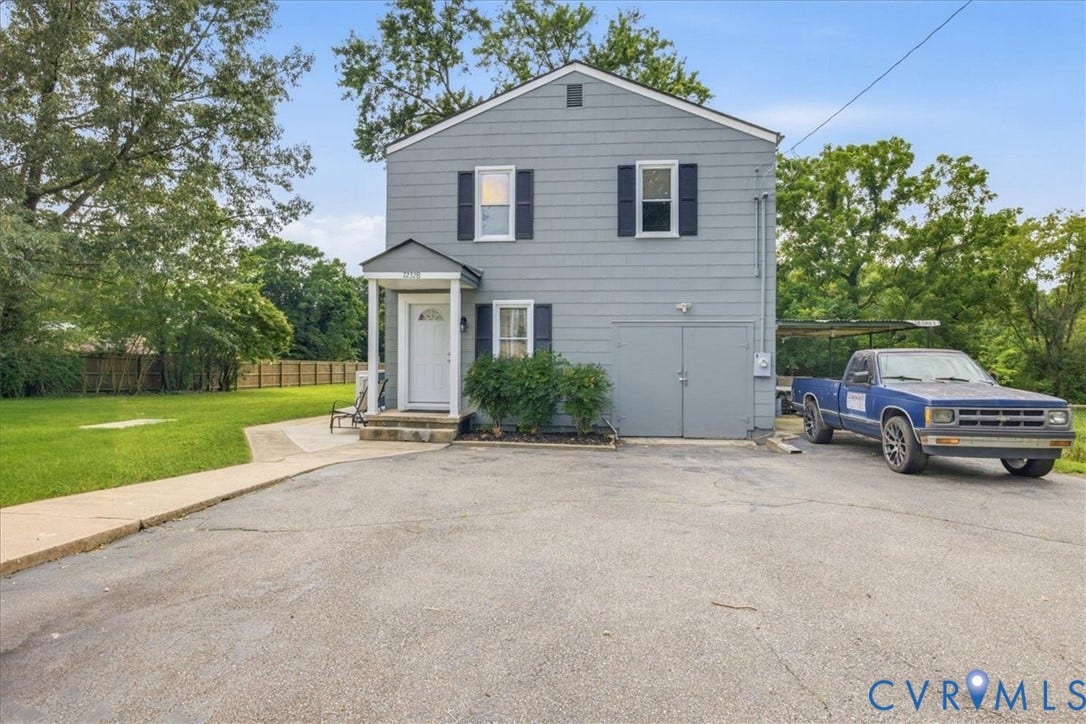 7232 Hopkins Road, North Chesterfield, VA 23237 Two-story property with gray siding and black window shutters
