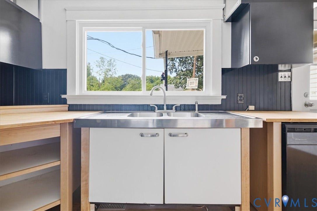 7232 Hopkins Road, North Chesterfield, VA 23237 Dual basin stainless steel sink with a chrome faucet