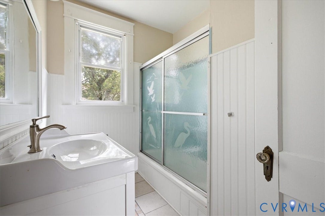 7232 Hopkins Road, North Chesterfield, VA 23237 White single vanity with an integrated sink and brushed nickel faucet