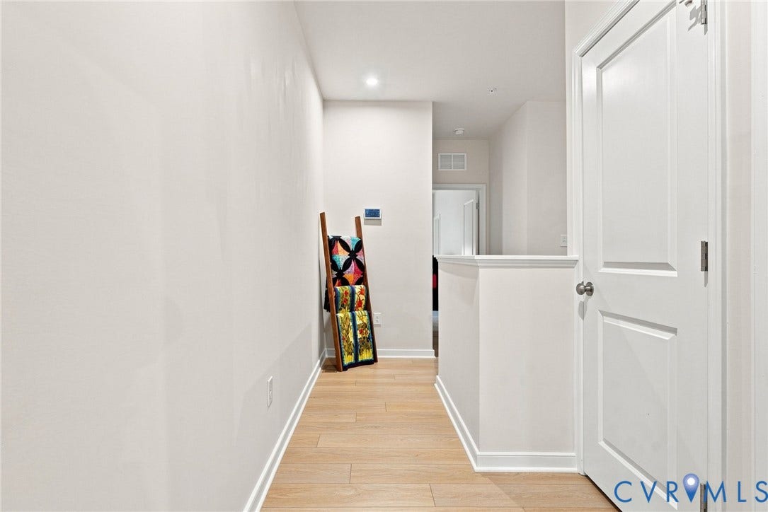 2445 Ownby Lane, #B15, Greater Scott's Addition, Richmond, VA 23220 Hallway featuring light-toned wood-finish flooring, recessed lighting, and crisp white walls