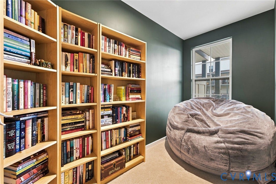 2445 Ownby Lane, #B15, Greater Scott's Addition, Richmond, VA 23220 Built-in shelving units, painted walls, and a single-hung window with exterior architectural details