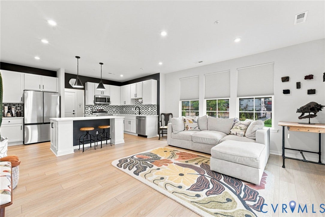 2445 Ownby Lane, #B15, Greater Scott's Addition, Richmond, VA 23220 Open-concept living space featuring wood-finish flooring, recessed lighting, and multiple windows