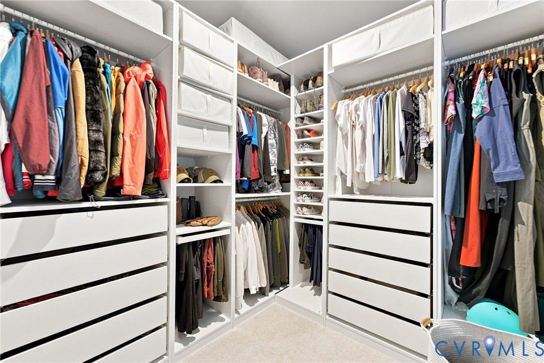 2445 Ownby Lane, #B15, Greater Scott's Addition, Richmond, VA 23220 Built-in closet system featuring multiple shelving units, integrated drawers, and ample hanging rods
