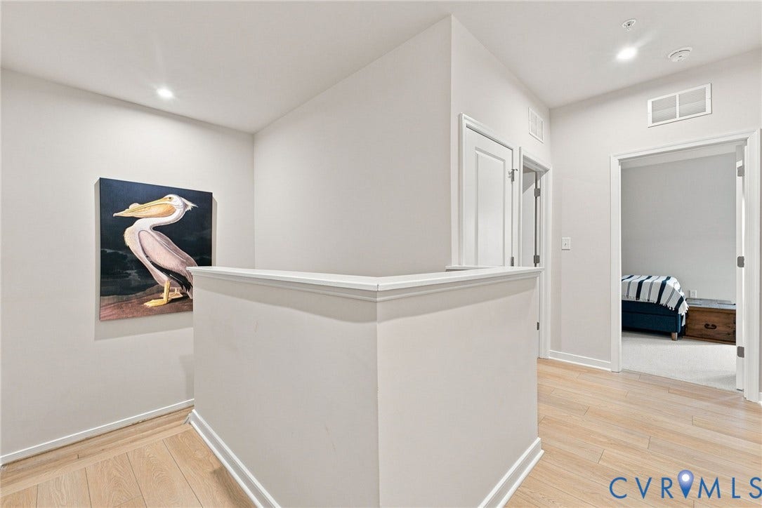 2445 Ownby Lane, #B15, Greater Scott's Addition, Richmond, VA 23220 Light wood-finish flooring with white baseboards and trim, recessed ceiling lighting, and panel doors