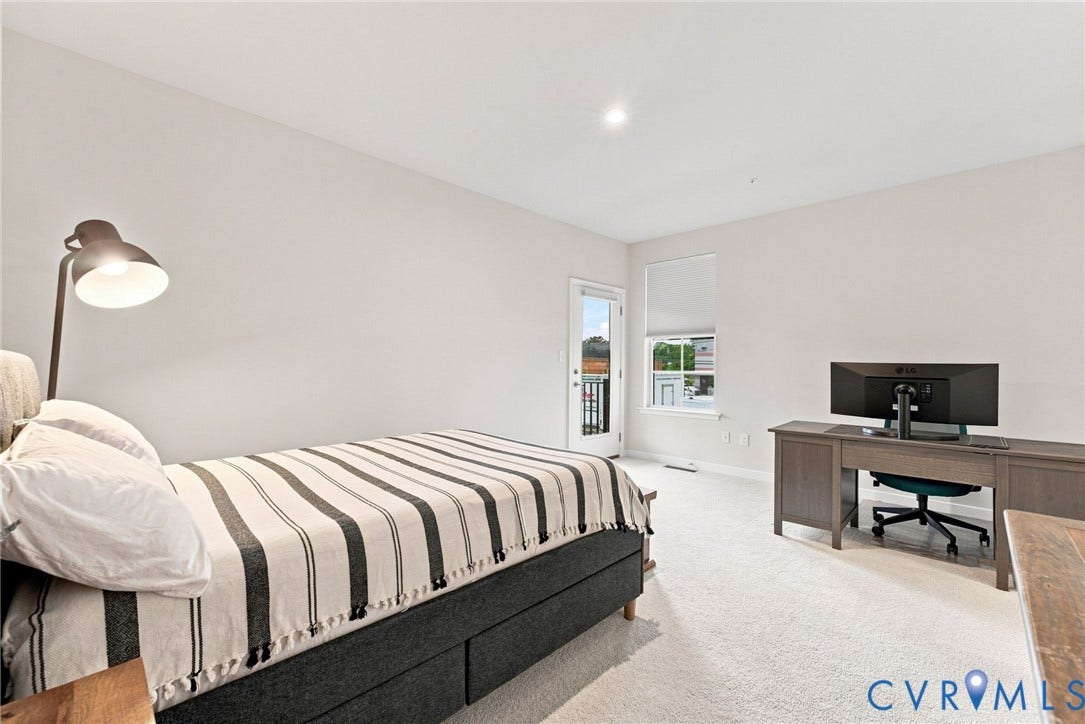 2445 Ownby Lane, #B15, Greater Scott's Addition, Richmond, VA 23220 Soft neutral wall tones, recessed ceiling lighting, light-toned carpeting, and a window with a roller shade