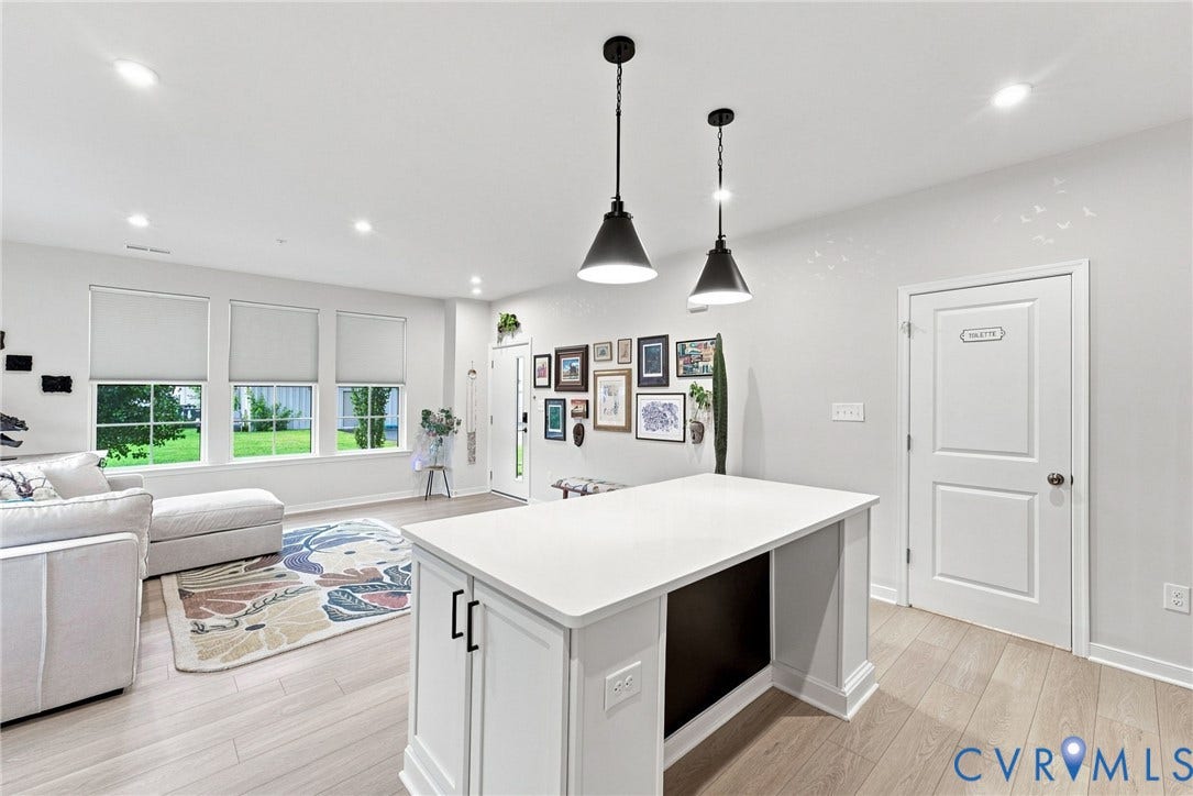 2445 Ownby Lane, #B15, Greater Scott's Addition, Richmond, VA 23220 Open-concept space featuring light wood-finish flooring, white walls, and recessed lighting