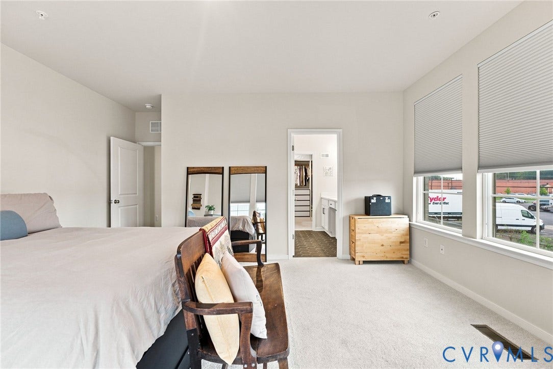 2445 Ownby Lane, #B15, Greater Scott's Addition, Richmond, VA 23220 Carpeted flooring, white walls, two large windows with horizontal motorized blinds, and recessed lighting