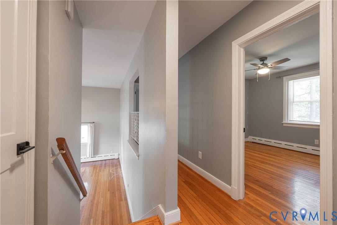 5709 Monument Avenue, Richmond, VA 23226 Hardwood flooring, painted walls, white trim, and a ceiling fan with light fixture