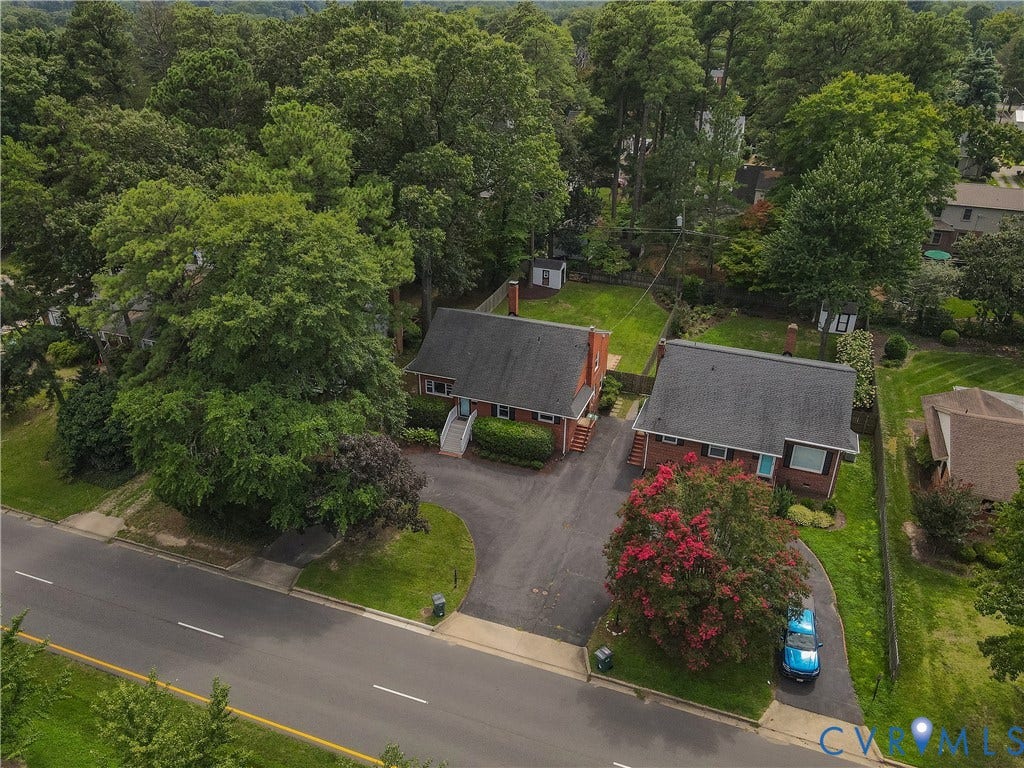 5709 Monument Avenue, Richmond, VA 23226 Extensive paved driveway, two brick residences, and mature trees