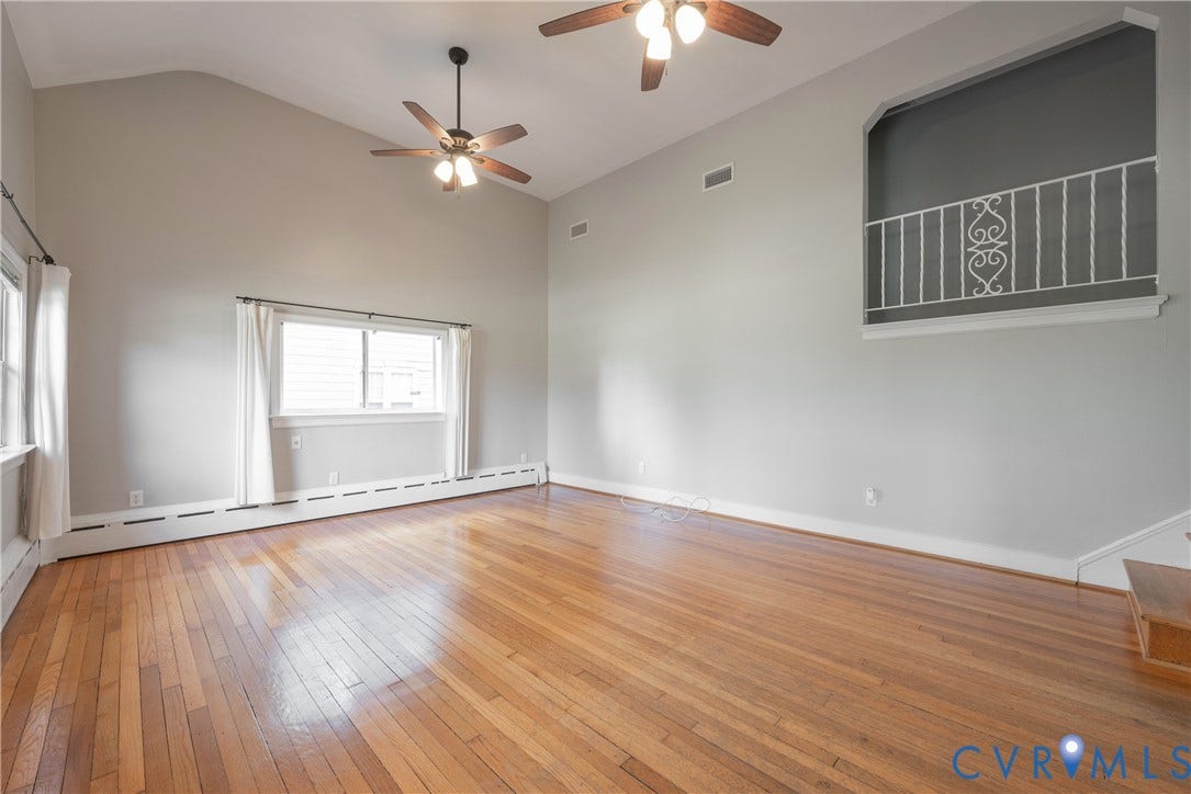 5709 Monument Avenue, Richmond, VA 23226 Living Room with tall ceilings and two fans/lights