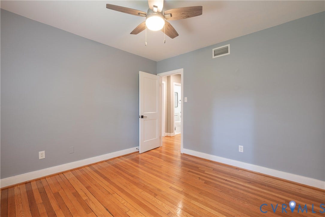 5709 Monument Avenue, Richmond, VA 23226 Bedroom #3 Hardwood flooring and neutral wall paint. Shares a full hall bath