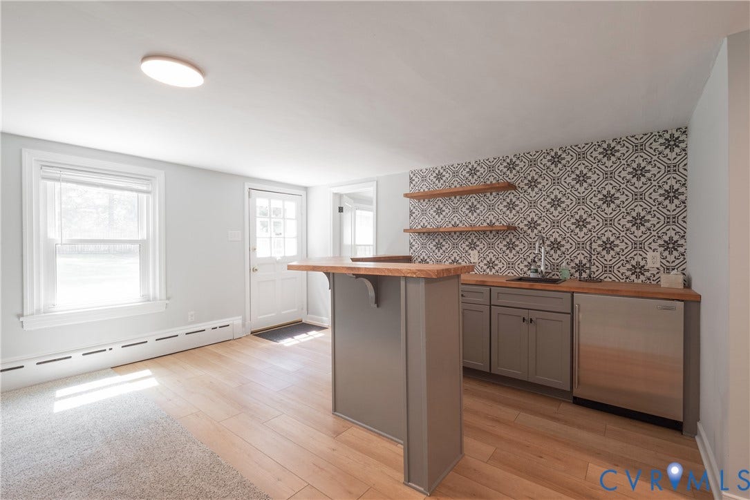 5709 Monument Avenue, Richmond, VA 23226 Rec Room - Bar - with counter for ample seating, custom tilework, sink, refrigerator and access to the patio