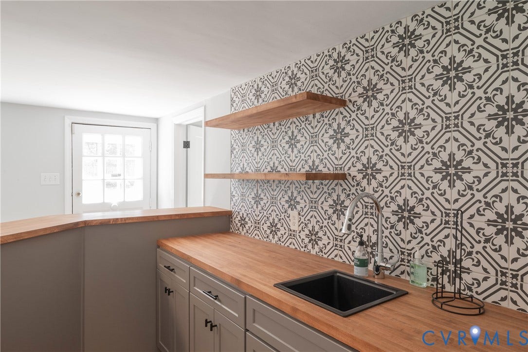 5709 Monument Avenue, Richmond, VA 23226 Rec Room - Bar - Built-in wet bar with wood-finish countertops, undermount sink, and decorative tile backsplash